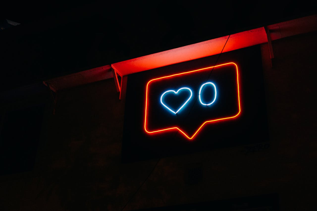 gallery-img-01 Bright neon heart icon with zero likes, symbolizing social media engagement.